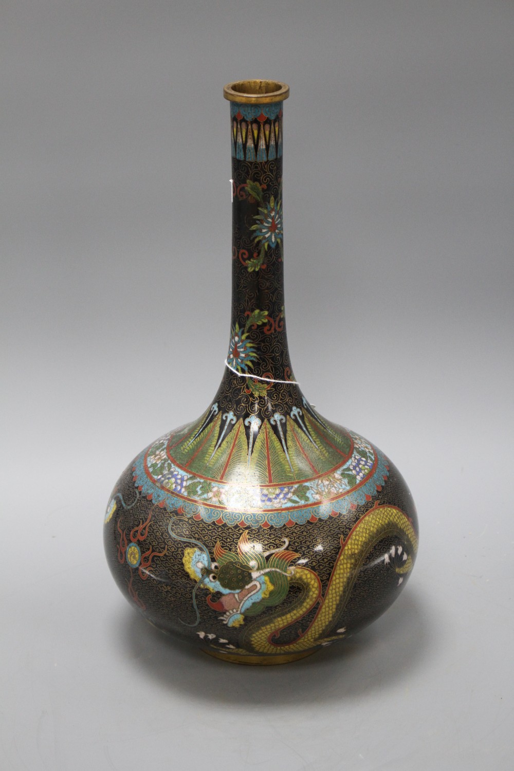 An early 20th century Chinese cloisonne vase, decorated with dragons on a black ground, height 38cm